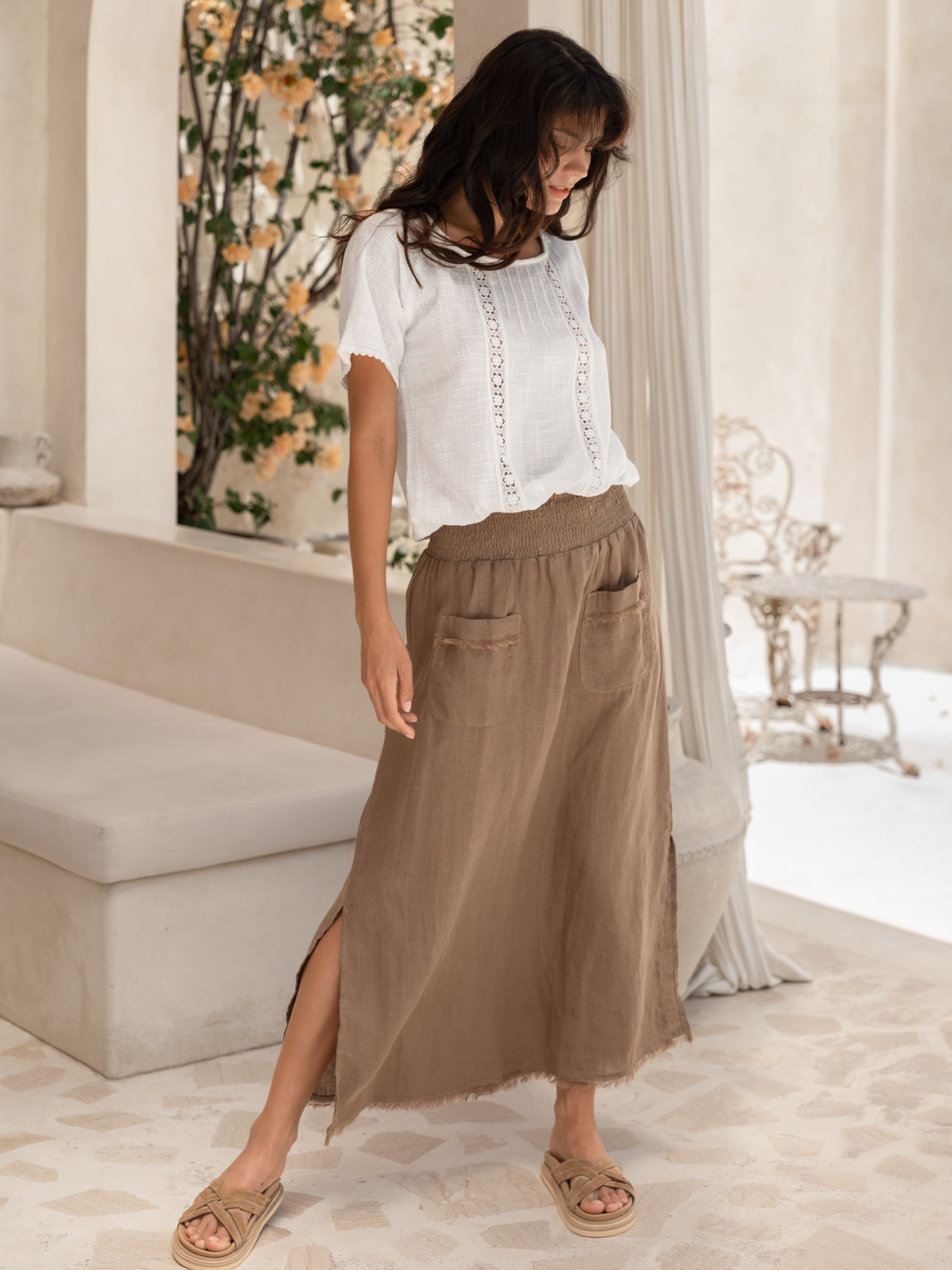 Model is wearing Aurora French Linen Skirt in Cinnamon