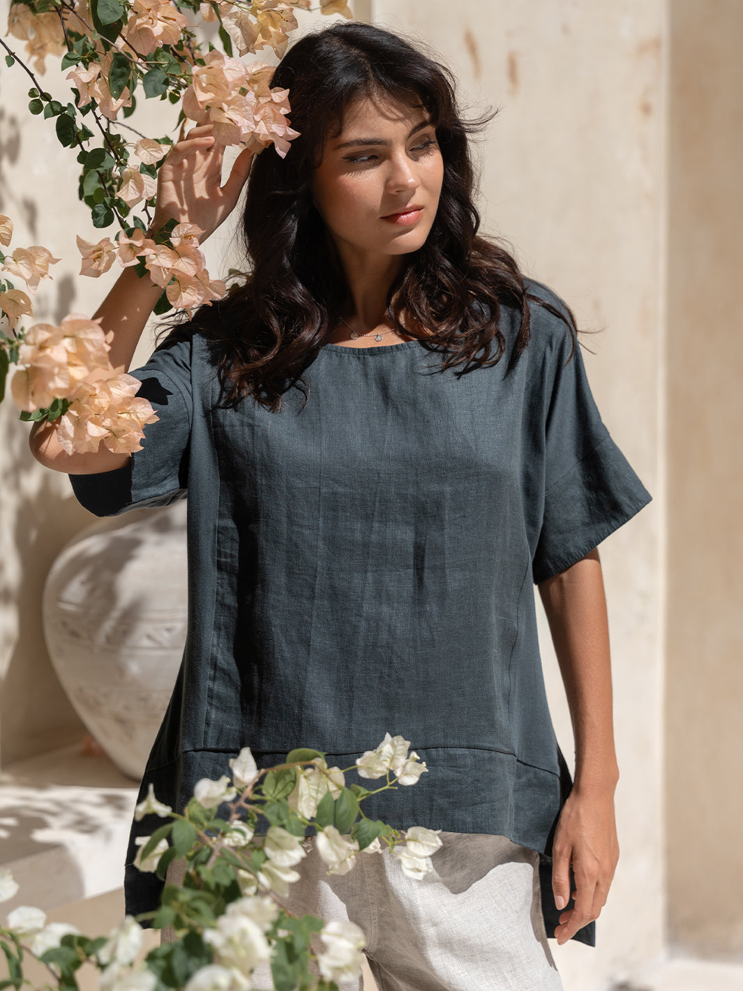 Model wears Costa French Linen and Cotton Top in Charcoal.